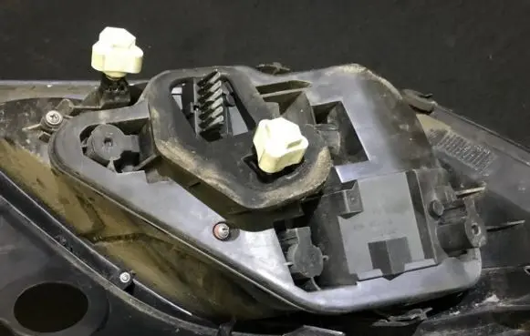 Tail light bulb cover holder