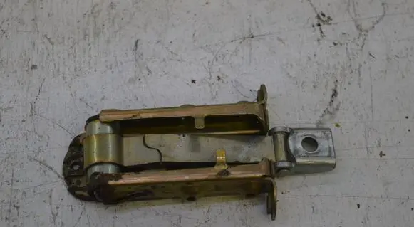Front door check strap stopper