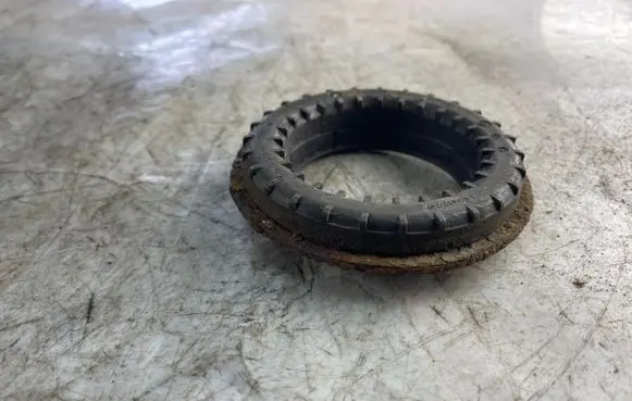 Volkswagen Touran I Coil spring mount 1k0412249