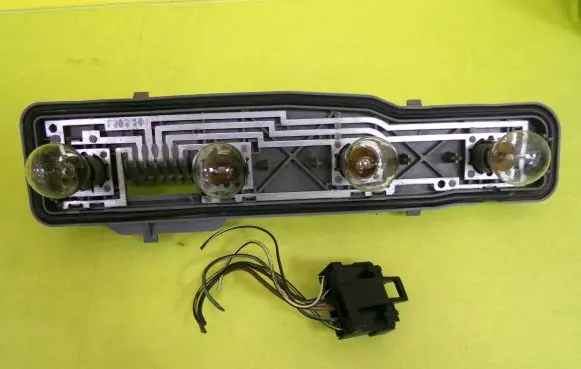 Tail light bulb cover holder