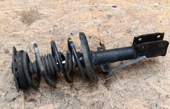 Front shock absorber with coil spring