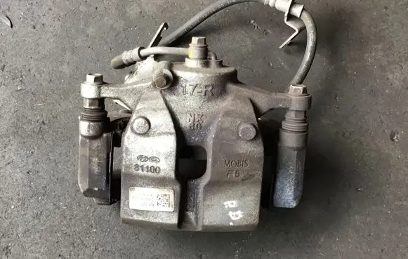 Hyundai Tucson IV NX4 Front brake caliper 58130N7100 81100