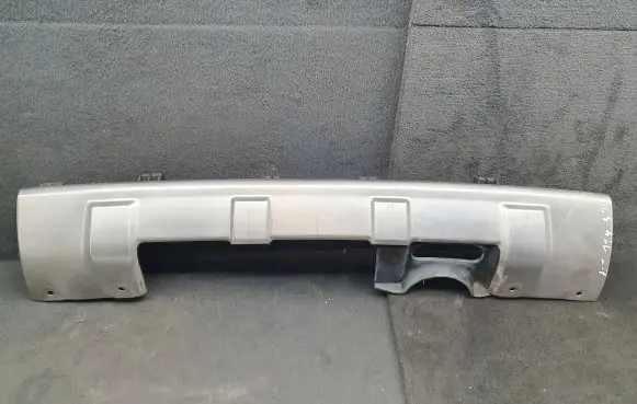 Rear bumper trim bar molding