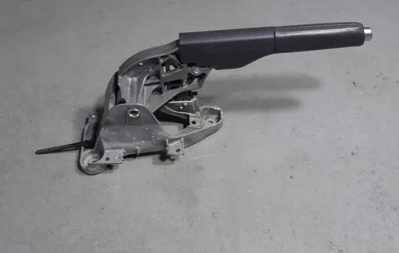 Volkswagen Golf V Hand brake release handle 1K0711303B