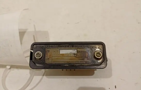 Volkswagen Golf V Number plate light 1J6943021B