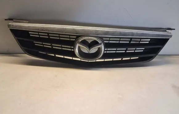 Mazda 626 Front bumper upper radiator grill GG2M50712