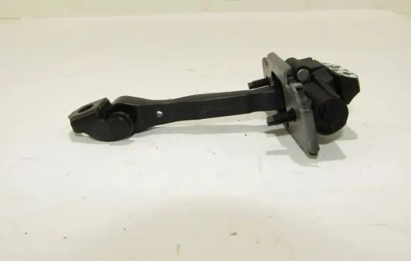 Front door check strap stopper