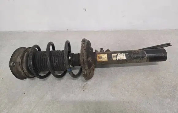 Volkswagen Golf VII Front shock absorber with coil spring 5Q0413023GR 5Q3412014C