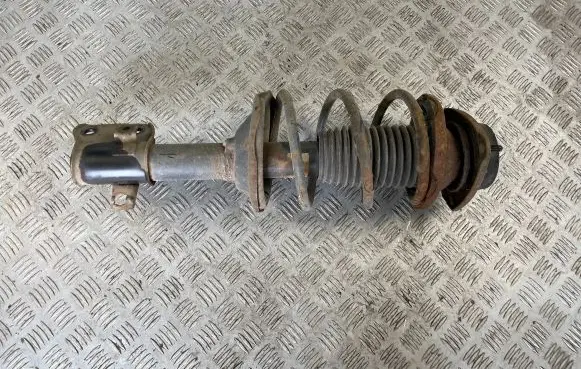Subaru Impreza I Front shock absorber with coil spring