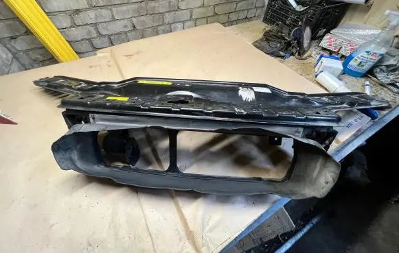 Top upper radiator support slam panel