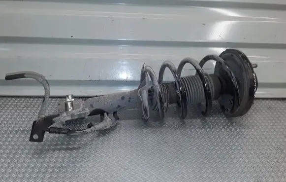 Nissan Primera Front shock absorber with coil spring