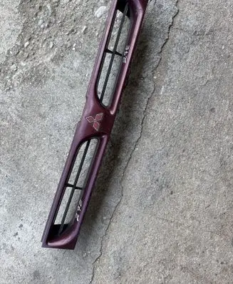 Mitsubishi Lancer Front bumper upper radiator grill MB696771