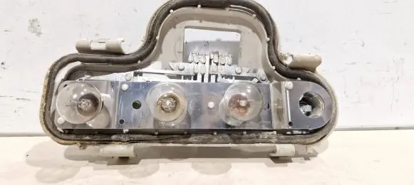 Tail light bulb cover holder