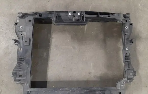 Radiator support slam panel
