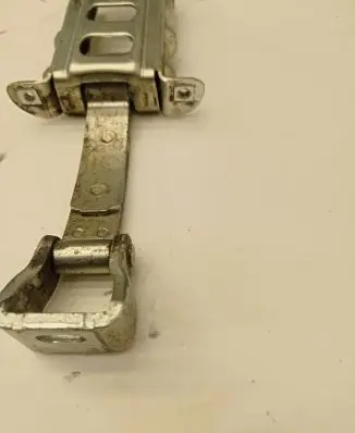 Front door check strap stopper