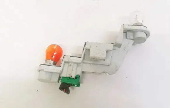 Volvo V50 Tail light bulb cover holder