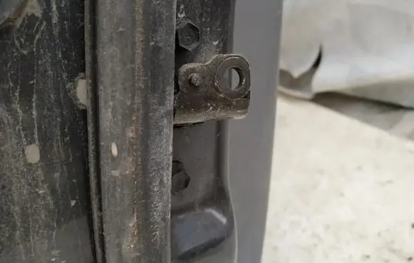 KIA Carens I Rear door check strap stopper