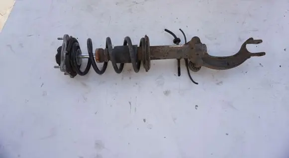 Renault Megane III Front shock absorber with coil spring MCPERSON