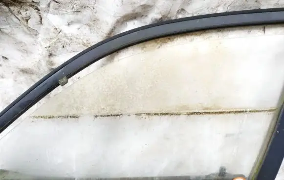 Mazda 121 Front door window glass four-door