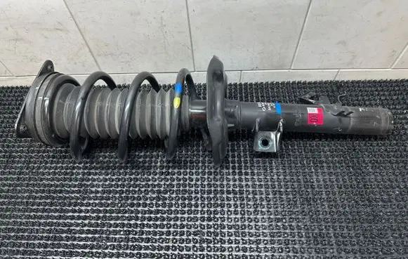 Front shock absorber with coil spring