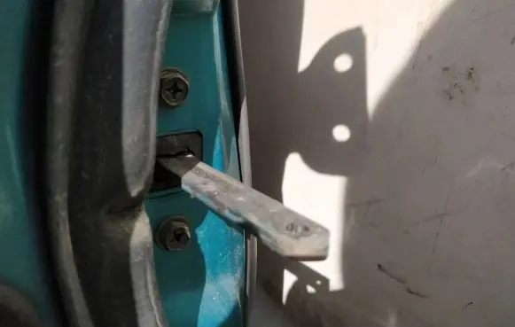 Front door check strap stopper