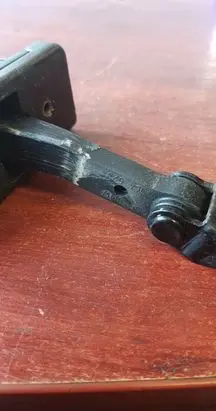 Front door check strap stopper