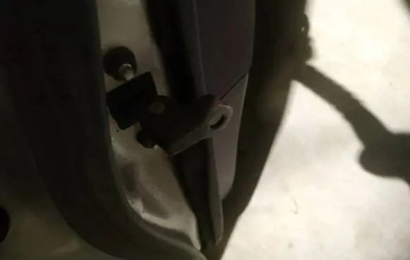 Rear door check strap stopper