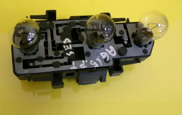 Tail light bulb cover holder