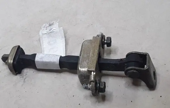 Nissan Primera Front door check strap stopper