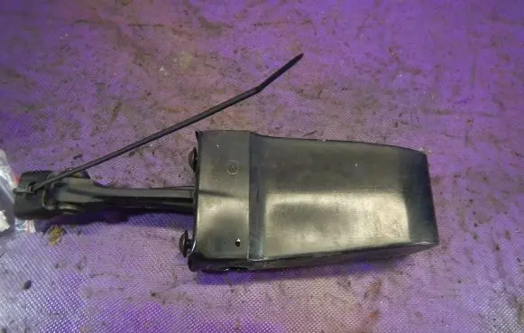 Front door check strap stopper