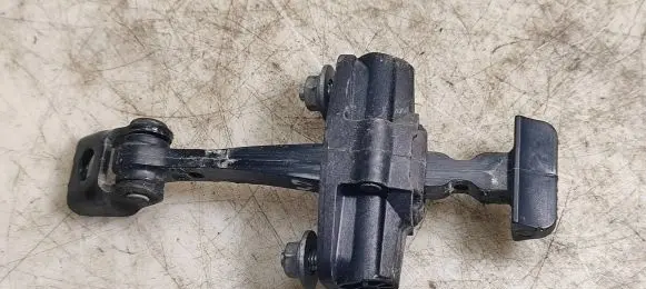 Rear door check strap stopper