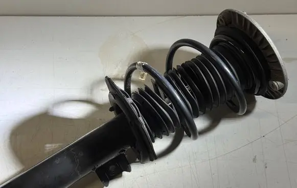 Front shock absorber with coil spring