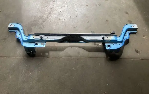 Top upper radiator support slam panel
