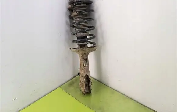 Volkswagen Caddy Front shock absorber with coil spring 6K0413031G