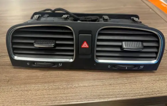 Volkswagen Golf VI Dash center air vent grill 5K0819733