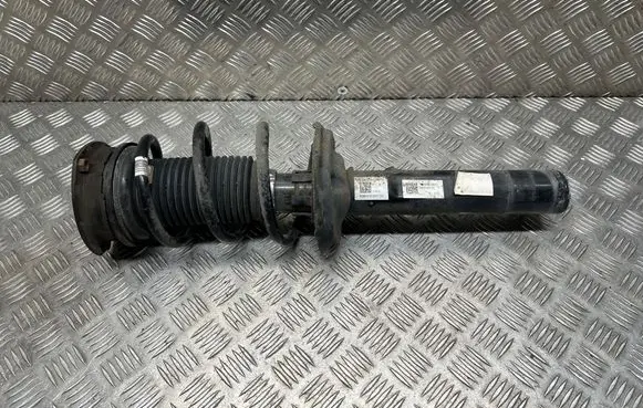 Volkswagen Golf VII Front shock absorber with coil spring 5Q0412037QH