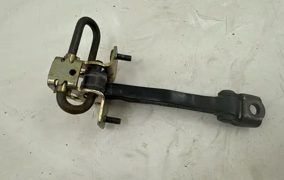 Front door check strap stopper