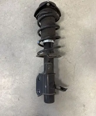 Front shock absorber with coil spring