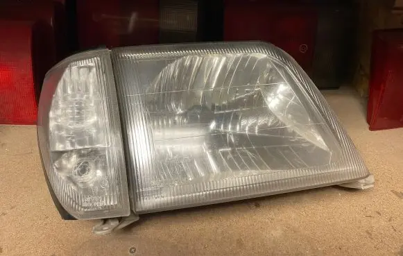 Toyota Land Cruiser (HDJ90) Headlight/headlamp 6086 11077015
