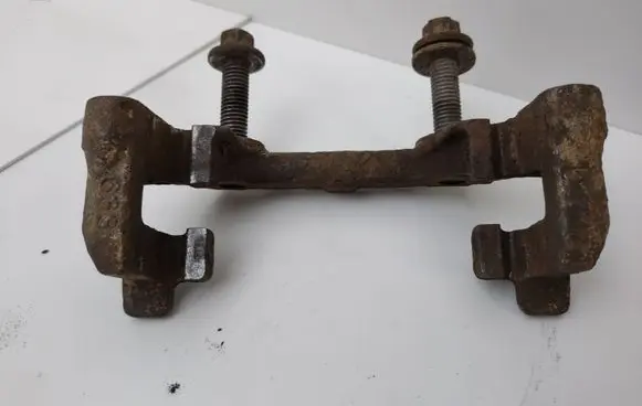 Saab 9-3 Ver2 Brake caliper pad carrier rear 93172188
