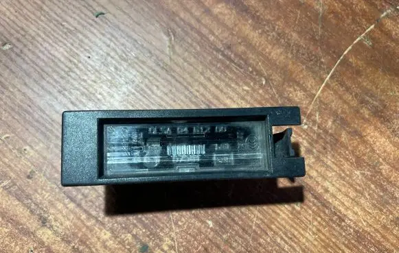 Opel Corsa D Number plate light 0461200 13139990