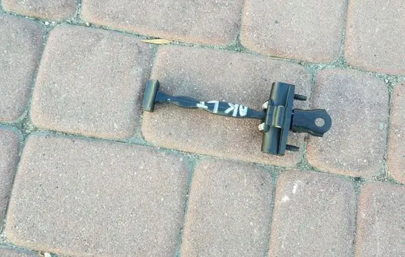 Rear door check strap stopper