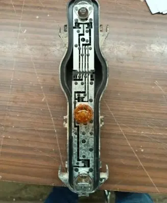 Tail light bulb cover holder