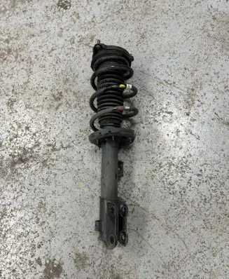 Front shock absorber with coil spring