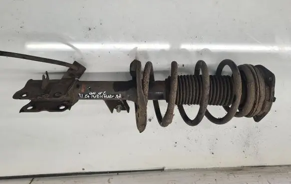 Nissan Qashqai+2 Front shock absorber with coil spring