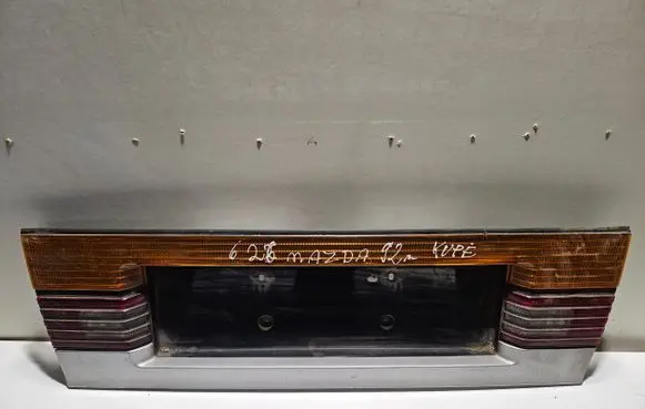 Mazda 626 Rear light center trim bar blend 0437835 0437835R
