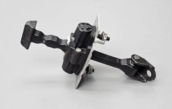 Front door check strap stopper