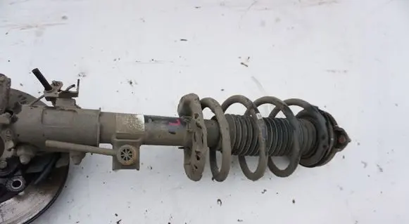 Hyundai Tucson TL Front shock absorber with coil spring MCPERSON