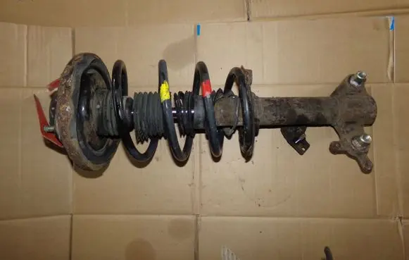Nissan Primera Front shock absorber with coil spring