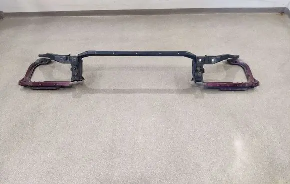 Top upper radiator support slam panel